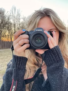 a woman taking a photo with her camera