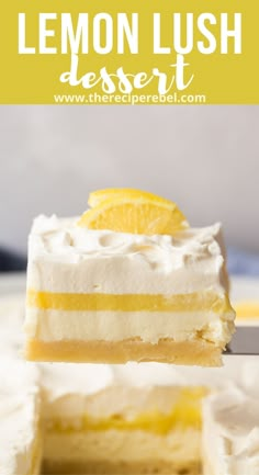 a lemon lush dessert with white frosting and fresh lemons on top is being held up by a fork