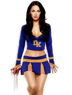 a woman dressed in a cheerleader outfit posing for the camera with her hands on her hips