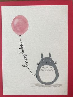 a card with a totoro holding a pink balloon