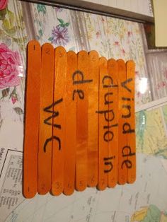 an orange wooden sign with words written on it