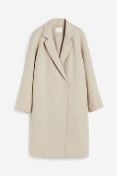 Double-breasted  knee-length coat in woven fabric. Notched lapels  concealed snap fasteners at front  raglan sleeves  and discreet side pockets. Vent at back. Lined. Closet Wishlist, Knee Length Coat, Beige Coat, Trip Outfits, Snap Fasteners, Long Coat, Light Beige, Raglan Sleeve, Double Breasted