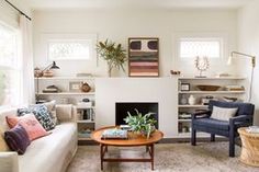 a living room filled with furniture and a fire place