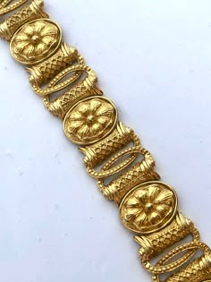 Beautiful Etruscan Egyptian Revival style bracelet in a rich golden color. The piece is high end, featuring an intricate floral design. It measures about 7.5 and weighs about 54.4g! Beautiful vintage condition and stamped both Trifari and Saltz on the back.  I have the matching earrings separately listed as well. See the last photo for an image of the set. Please see all photos and ask any questions. All items sold as found from estates and my own personal family collection. Thank you for shoppi Luxury Ceremonial Jewelry With Motifs, Luxury Brown Hand-tooled Jewelry, Luxury Ornate Gold Plated Jewelry, Cheap Gold Antique Finish Jewelry, Luxury Antique Finish Jewelry For Wedding, Luxury Hand Set Festive Sets, Luxury Ancient Style Collectible Jewelry, Medieval Jewelry Egyptian, Luxury Heirloom Bronze Jewelry