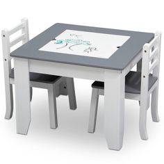 a child's table and two chairs with a drawing on the top, set against a white background