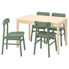 a table and four chairs with one chair up against the other, all in green