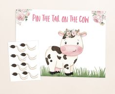 a card featuring a cow with flowers on its head and the words pin the tail on the cow