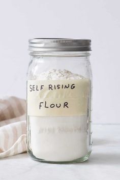 a jar filled with flour sitting on top of a table