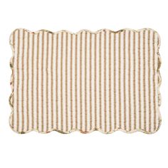 a white and brown striped placemat with scalloped edges on a white background