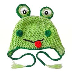 a green crocheted hat with eyes and ears