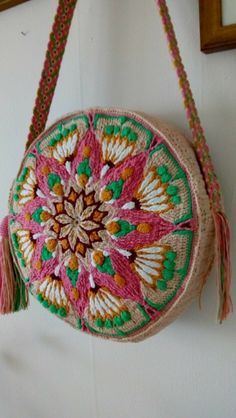 a round purse hanging on the wall