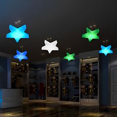 an empty room with several stars on the ceiling and lights in the closet above it