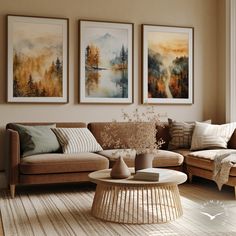 a living room filled with furniture and paintings on the wall above it's coffee table