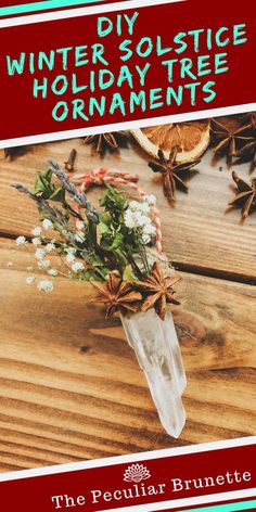 an advertisement for the winter solstice holiday tree ornament, featuring flowers and pine cones