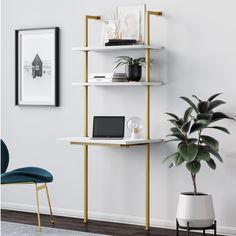 a room with a chair, bookshelf and potted plant