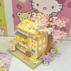 a toy store with hello kitty decorations on the front and side of it's display