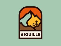 an image of a mountain with trees and the word aiguille in it's center