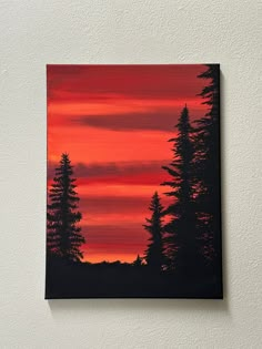 an acrylic painting of some trees in the sunset with red and orange colors