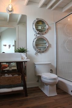 a bathroom with a sink, toilet and shower