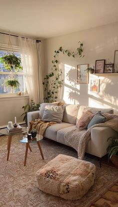 a living room filled with furniture and plants