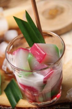 a small glass filled with ice and candy