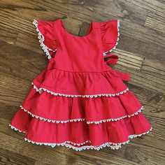 Red Patpat Spanish-Style Frilly Festive Girl Dress Size 12-18m. Nwt. 100% Cotton. Featuring Adorable Bow Tie Back And Tiered Layers. White Lace Frill Lines Layers. Perfect For Parties. Spring Holiday Dress With Ruffles, Cute Red Ruffled Dress, Cute Red Dress With Ruffles, Red Ruffled Dresses For Playtime, Cute Red Dress For Dress-up Occasions, Cute Red Dress For Play, Cute Red Holiday Dress, Red Cotton Dress For Play, Red Cotton Casual Dress