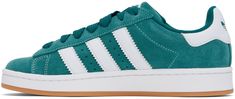 Low-top suede and buffed leather sneakers in green. · Lace-up closure · Logo embossed at padded tongue and heel tab · Padded collar · Text embossed at outer side · Perforated detailing and signature serrated stripes at sides · Terrycloth lining · Treaded rubber sole Supplier color: Legacy teal/Cloud white/Gum Green Suede Sneakers With Boost Midsole, Green Suede Skate Shoes With Round Toe, Green Suede Round Toe Skate Shoes, Green Leather Skate Shoes With Vulcanized Sole, Green Leather Skate Shoes With Rubber Waffle Outsoles, Green Suede Skate Shoes With Gum Sole, Green Leather Skate Shoes With Perforated Toe Box, Green Suede Lace-up Skate Shoes, Green Suede Skate Shoes For Streetwear