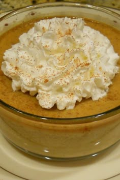 a bowl filled with whipped cream on top of a table