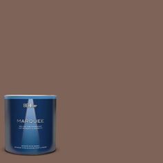 a can of marquee white paint on a gray background with the words marquee written below it