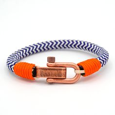 Easy to wear everyday or able to be dressed up for formal occasions, it is waterproof and fast-drying, retaining its shape over time. Constructed from hard-wearing and fade-resistant nylon marine cord with a shackle closure, these bracelets will make a strong fashion statement for a long time to come. The classic shackle closure unscrews using a pin and screw method to place on wrist. Once on, the pin has to be screwed back in to the shackle to secure bracelet in place. Choose from two styles. S Men Bracelet, Cord Bracelet, Cord Bracelets, Blue Bracelet, Out On The Town, Paracord, Mens Fashion Casual, Bracelets For Men, Rope Bracelet