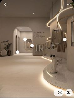 the interior of a clothing store with white lighting