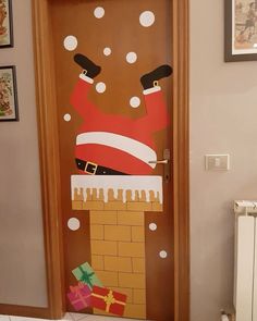 a door decorated with santa clause and presents