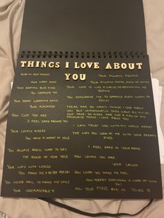 a black notebook with writing on it that says things i love about you written in gold