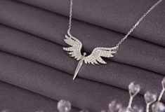 925 Silver Unique Phoenix  Necklace, Guardian Angel Necklace,  Archangel Michael Necklace, 925 Silver Angel Wings Necklace,  Guardian  Angel          Dedtails:     Handmade item       Materials:925 Silver     Style: Minimalist     Made to Order     CARE INSTRUCTIONS :  Our products are made of high quality 925 sterling silver, you can use them for many years if you maintain them regularly. To maintain the quality of your new jewelry, please: -Avoid contact with perfumes, body oils , shampoos, an Angel Wings Necklace, Guardian Angel Necklace, Phoenix Necklace, Wings Necklace, Silver Angel Wings, Angel Wing Necklace, Angel Necklace, Body Oils, Wing Necklace