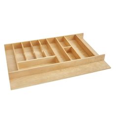 a wooden tray with compartments on top of it