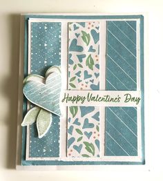 a happy valentine's day card with a paper heart and ribbon on the front