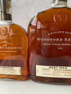 two bottles of woodford reserve sit next to each other