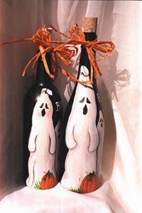 two black and white bottles with ghost decorations on them