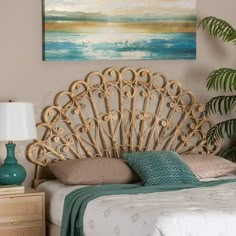 a bedroom scene with focus on the bed's headboard and nightstand, which has a painting hanging above it