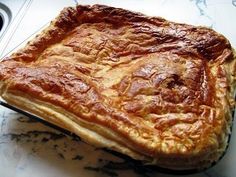 a large piece of food sitting on top of a counter next to a stovetop oven