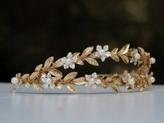 A bridal leaf crown you can easily placed on your hair and suit varied hair styles. made of silver or 14K gold plated on brass. *Could be requested in silver or gold plating* **The shipping arrives between 8-10 days where priority registered mail is available (EU, US, Canada, and more is shipped priority) ** You can upgrade to EMS shipping option to speed up delivery time to 3-4 days Materials: Gold plating, silver plating, brass Back to my shop: https://www.etsy.com/shop/sigalshakkedjewelry If Greek Tiara, Greek Goddess Crown, Laurel Wreath Crown, Gold Laurel Wreath, Gold Leaf Crown, Gold Leaf Headband, Laurel Crown, Crown Aesthetic, Goddess Crown