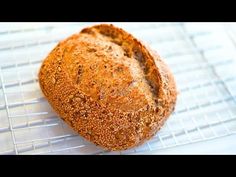 a loaf of bread sitting on top of a cooling rack