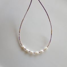 You can use this Everyday Freshwater Pearl Tiny Gold Beaded Necklace with your other necklaces and chains or alone. The pearl necklace is the perfect gift. Also the Dainty Pearl Choker has an extension chain of about 1 inch. Each Beaded Necklace has used purple (lilac) seed beads, golden seed beads, clear seed beads, natural freshwater pearls. This pearl choker is 24K Gold Plated Extension I used the chain, 24K Gold Plated lobster claw, stainless steel jewelry wire. >Click on the link for Other pearl chokers,delicate necklace,dainty necklace,beachy necklaces,multi colored necklaces, beaded necklace. https://www.etsy.com/shop/dkSeedbead?ref=seller-platform-mcnav Beachy Necklaces, Simple Choker Necklace, Choker Simple, Beachy Necklace, Simple Choker, Gold Beaded Necklace, Necklaces Beaded, Multi Coloured Necklaces, Gold Bead Necklace