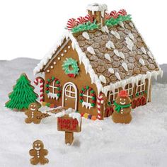 a gingerbread house is decorated with candy canes and christmas decorations for the holiday season