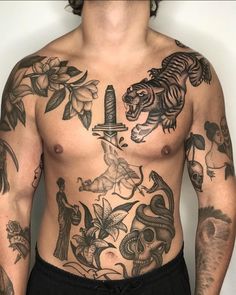 a man with many tattoos on his chest