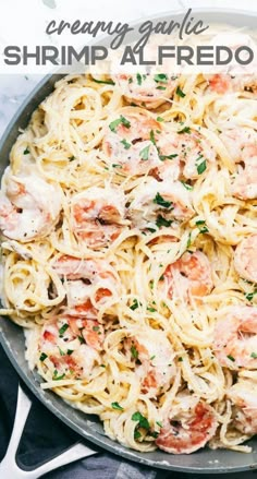 shrimp alfredo in a skillet with text overlay