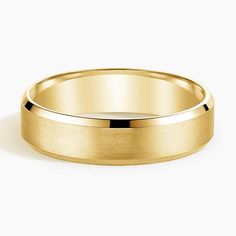 a yellow gold wedding ring with a flat surface and polished finish, on a white background