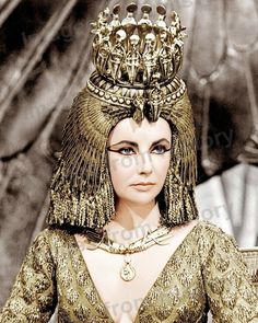 an egyptian woman wearing gold jewelry and headdress in a scene from the film