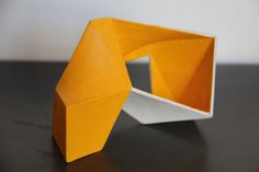 an orange and white object sitting on top of a table