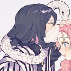 two anime characters are hugging each other and one is holding a snake on his shoulder